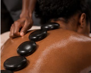 Hot stone massage at Timeless Glo